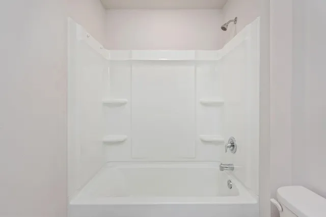 a close view of a bathtub in bathroom