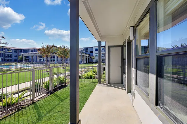 a view of a porch with an outdoor seating
