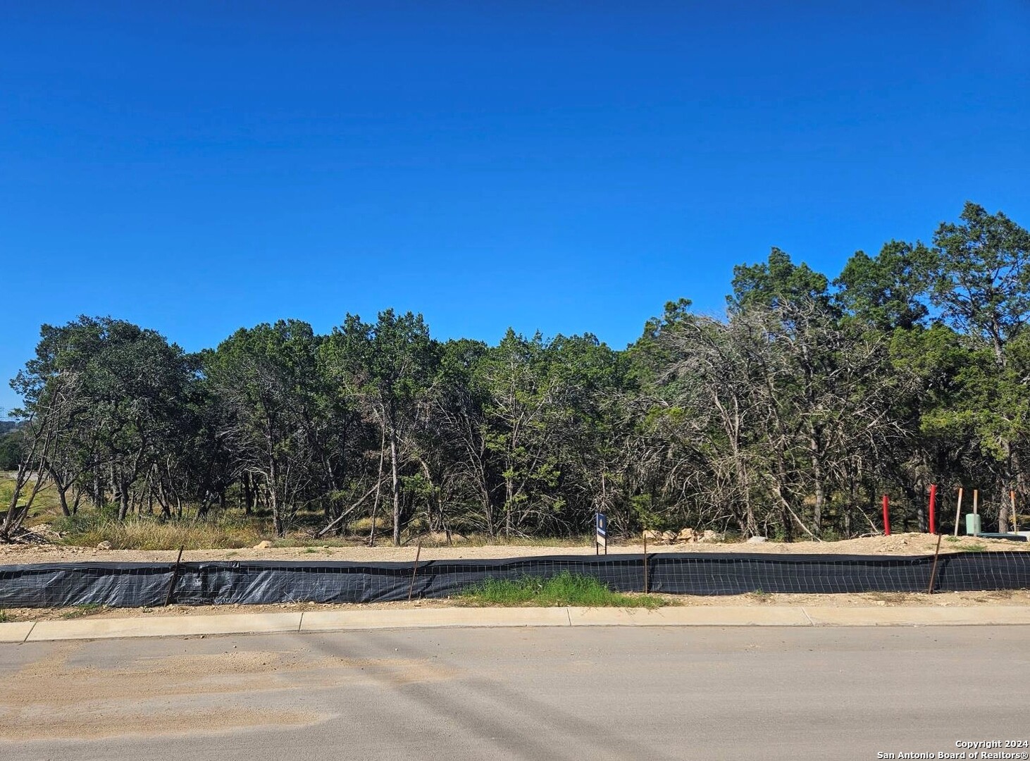 8155 Blue Oak Way Garden Ridge, TX 78266 - Photo 3 of 4 a view of a swimming pool with trees in the background