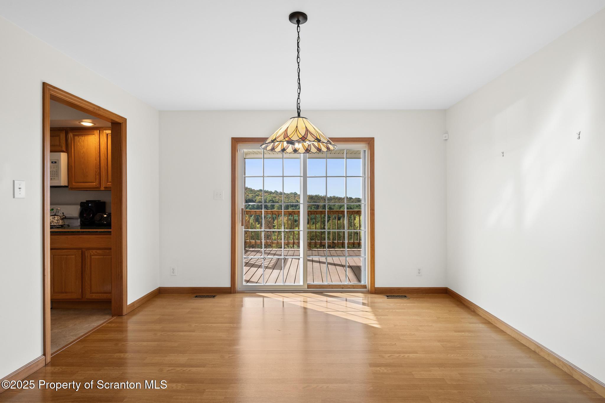 1336 Bush Road Montrose, PA 18801 - Photo 15 of 55 a view of empty room with wooden floor and window