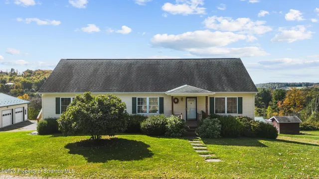 a view of a house with a yard