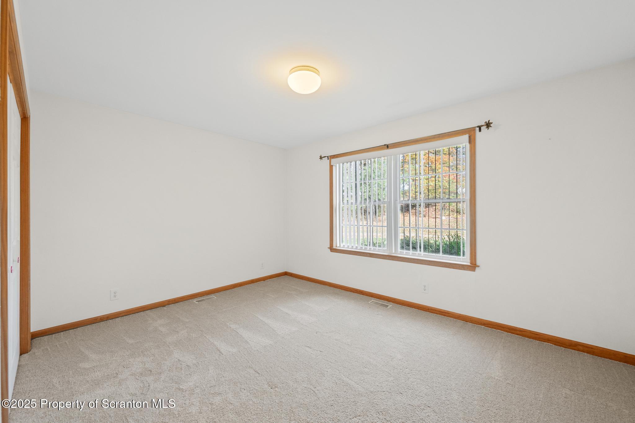1336 Bush Road Montrose, PA 18801 - Photo 23 of 55 an empty room with a window