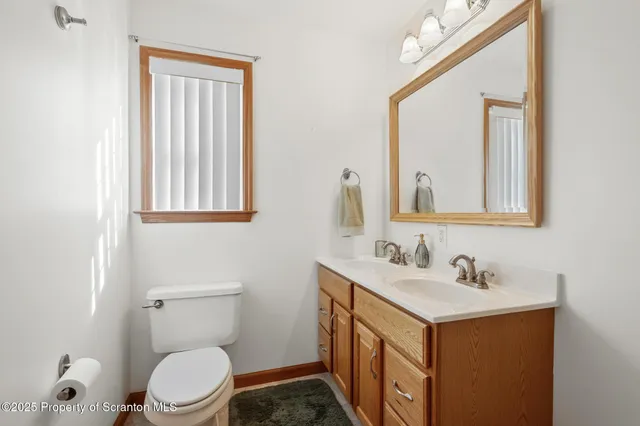 a bathroom with a shower and a window