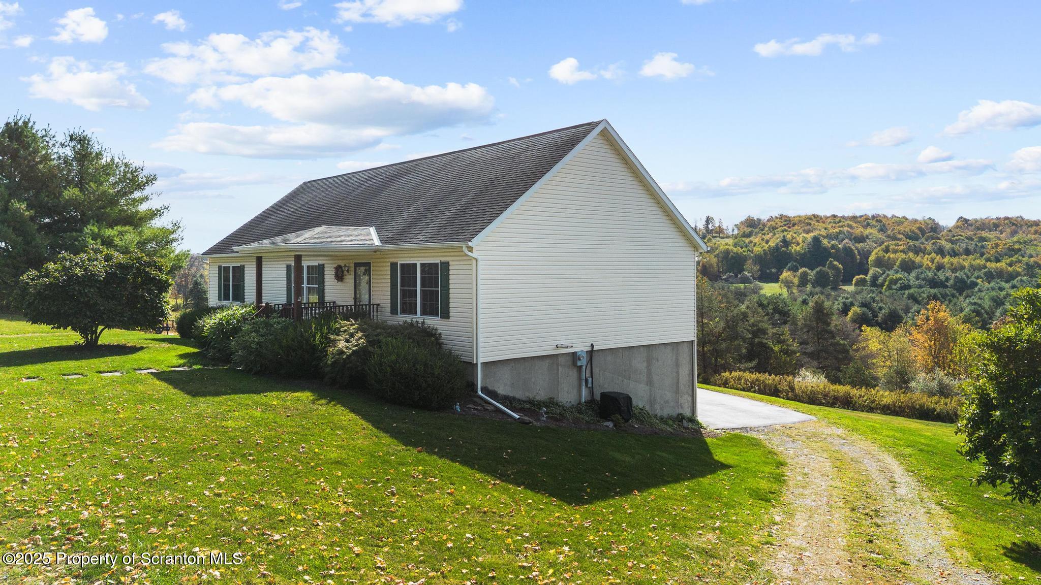 1336 Bush Road Montrose, PA 18801 - Photo 3 of 55 a view of a house with a yard
