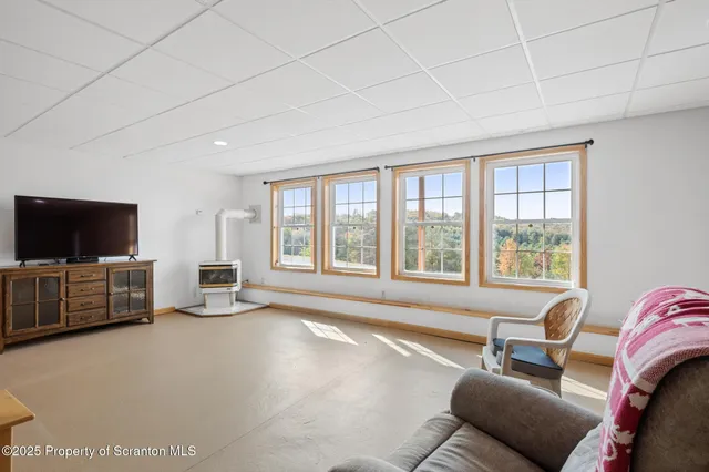 a front view of a house with a large window