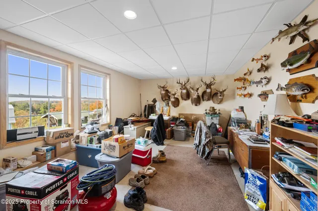 a room with furniture a rug and a chandelier