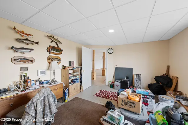 a view of walk in closet with clothes