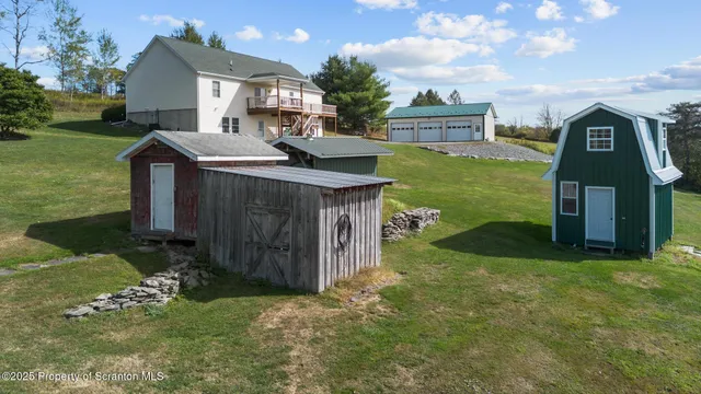 a view of a house with a yard porch and sitting area