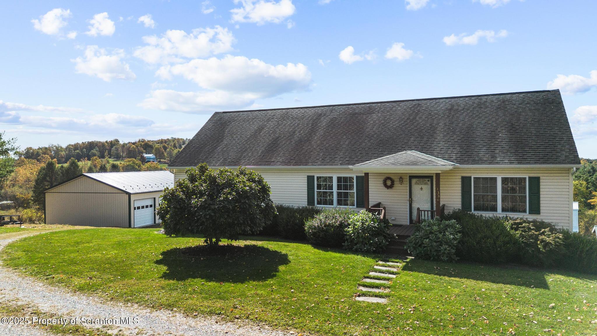 1336 Bush Road Montrose, PA 18801 - Photo 47 of 55 a front view of a house with a yard
