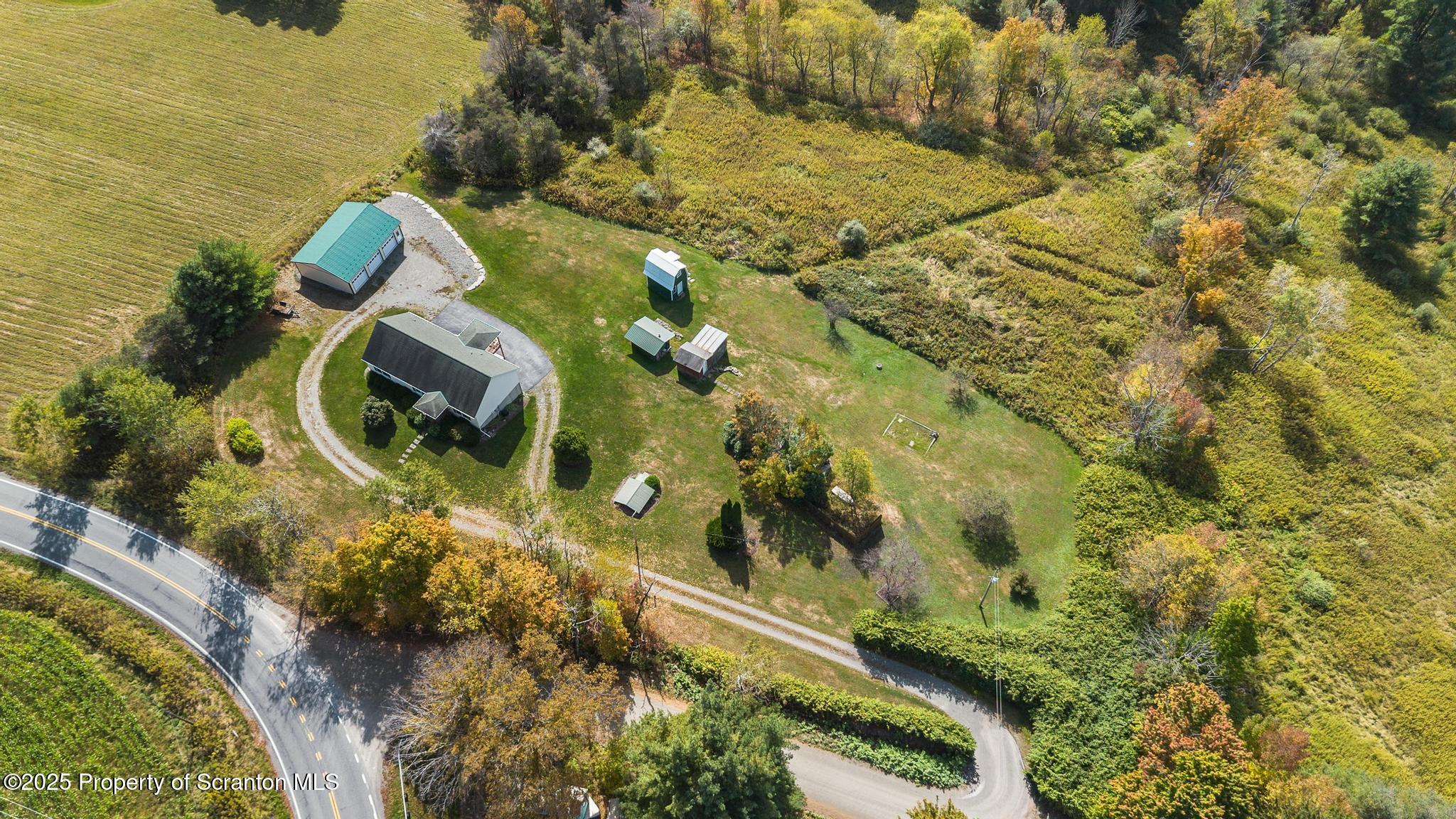 1336 Bush Road Montrose, PA 18801 - Photo 48 of 55 an aerial view of residential houses with outdoor space