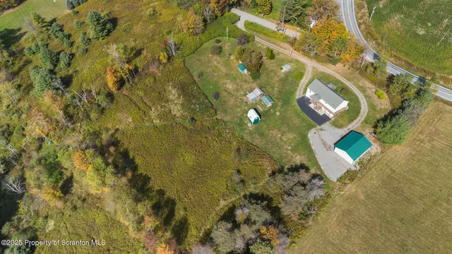 a view of house with a yard