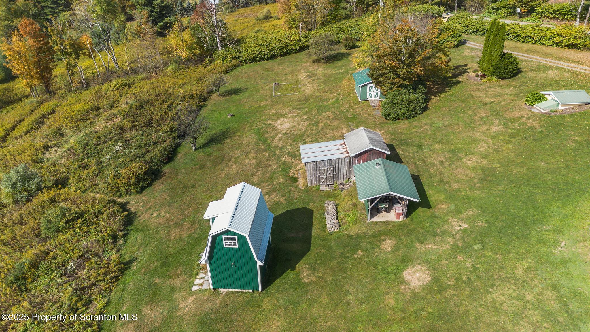 1336 Bush Road Montrose, PA 18801 - Photo 51 of 55 a aerial view of a house with a yard and large trees