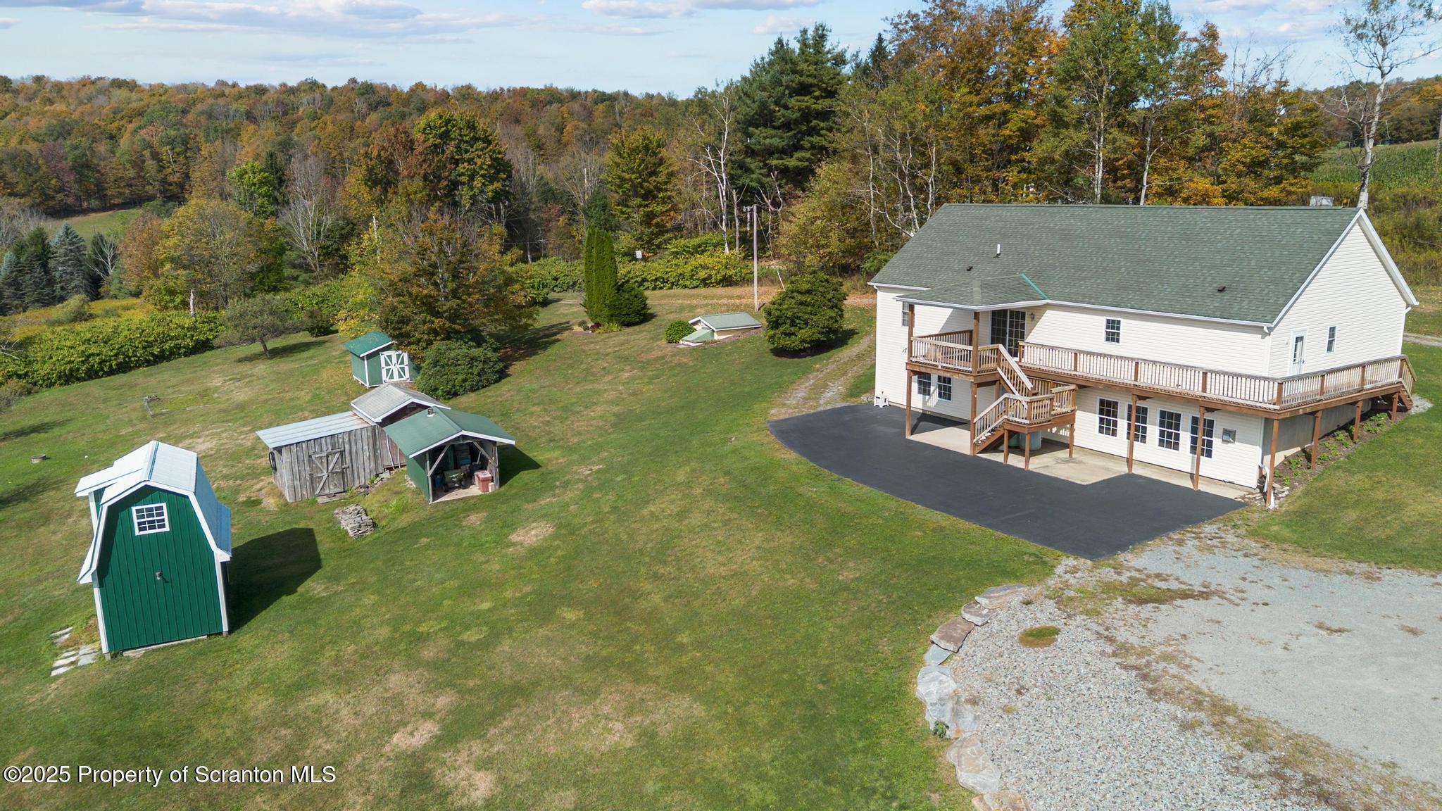 1336 Bush Road Montrose, PA 18801 - Photo 54 of 55 an aerial view of a house with swimming pool and mountain view