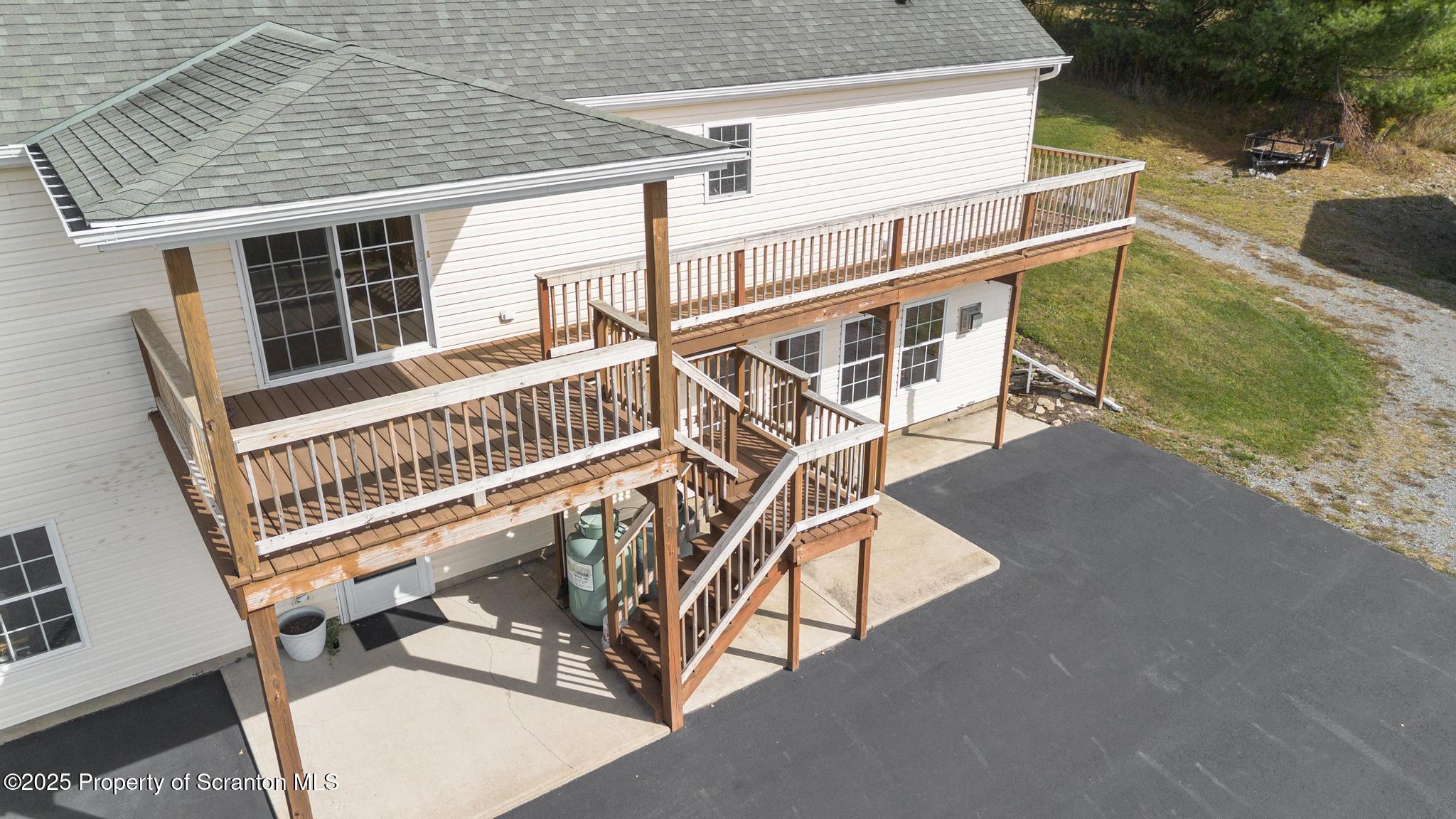 1336 Bush Road Montrose, PA 18801 - Photo 7 of 55 a view of balcony with two chairs and a wooden deck