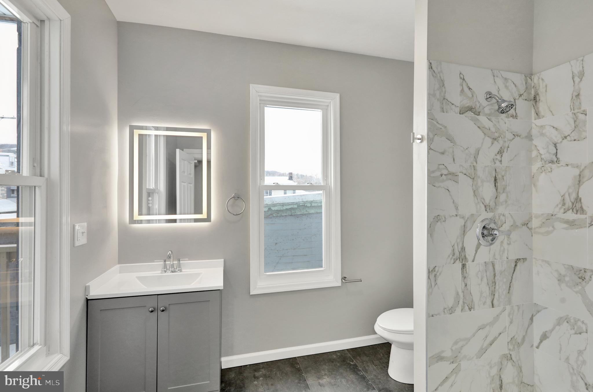 1156 Franklin Street, Unit 2 Reading, PA 19602 - Photo 4 of 7 a bathroom with a sink toilet and shower