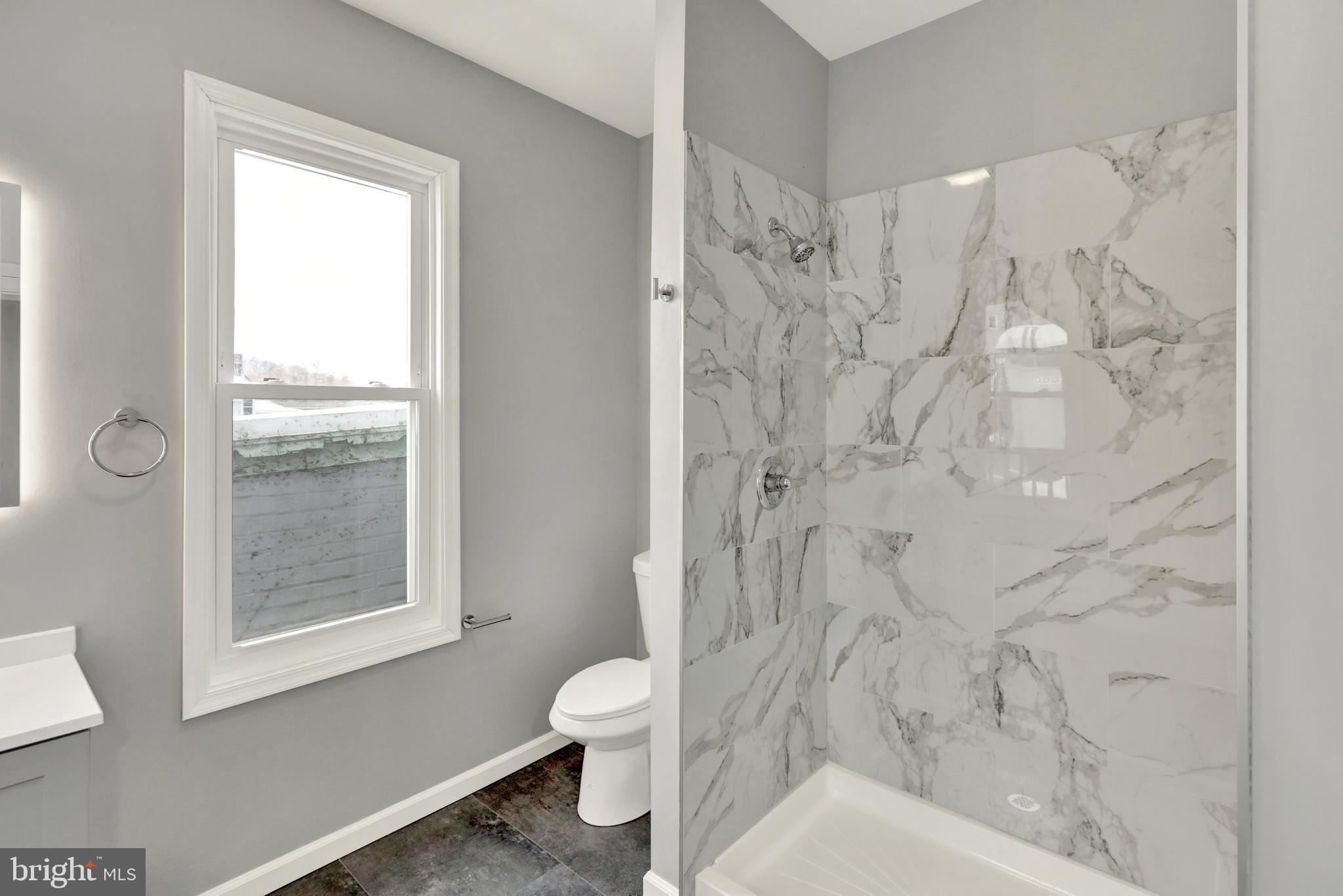 1156 Franklin Street, Unit 2 Reading, PA 19602 - Photo 5 of 7 a bathroom with a toilet and shower