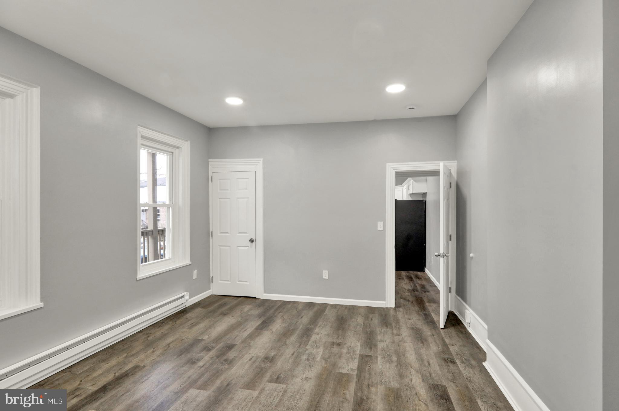 1156 Franklin Street, Unit 2 Reading, PA 19602 - Photo 6 of 7 wooden floor in an empty room with a window