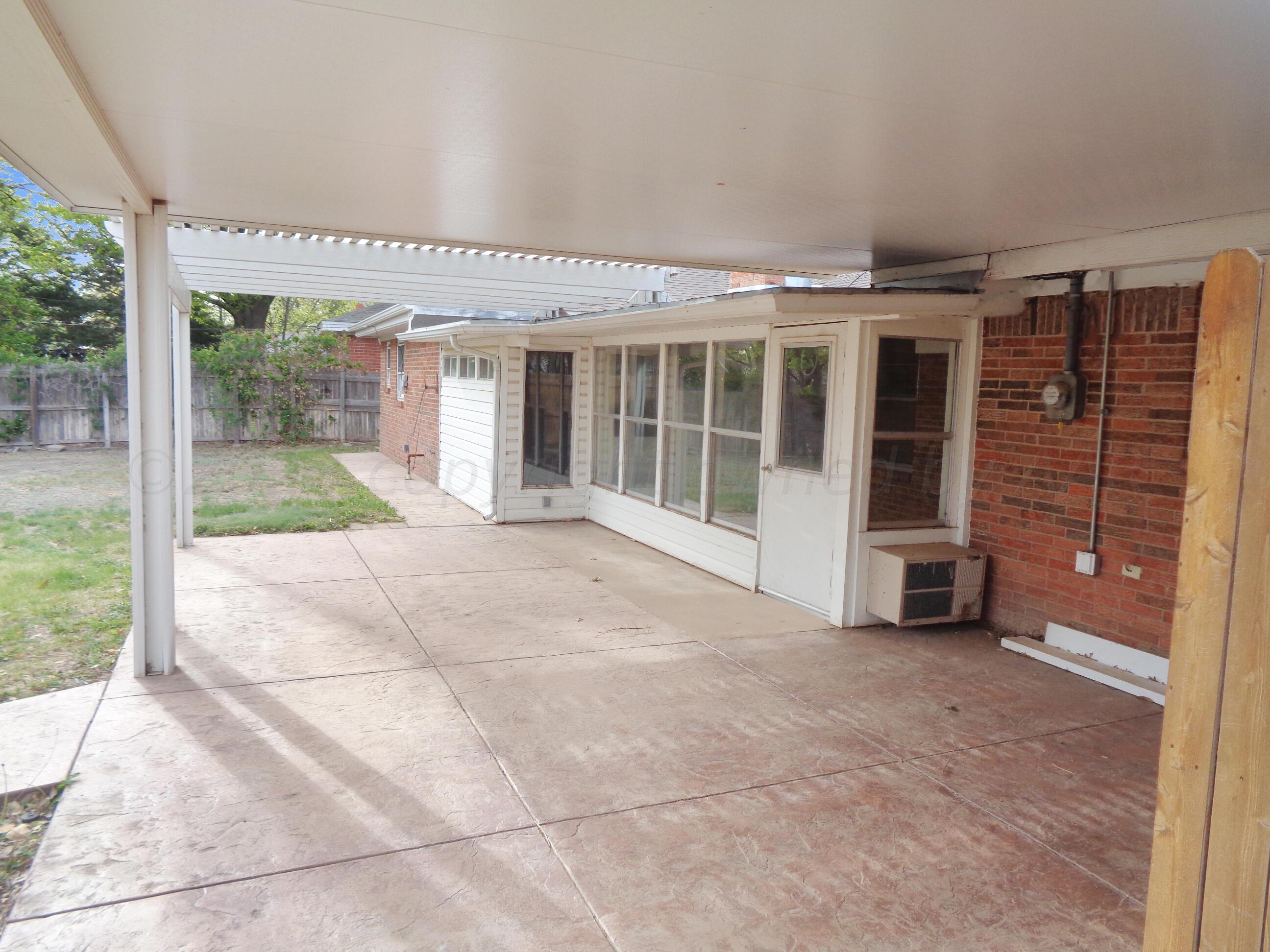 7108 Elmhurst Road Amarillo, TX 79106 - Photo 9 of 26 front view of a building with a porch