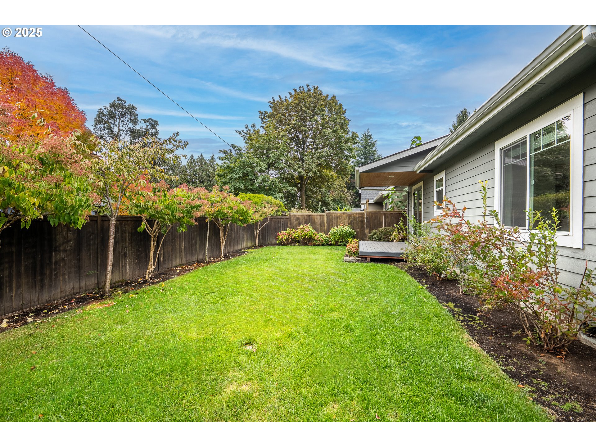 2355 Pioneer Pike Eugene, OR 97401 - Photo 2 of 29 a view of a backyard with plants and a garden