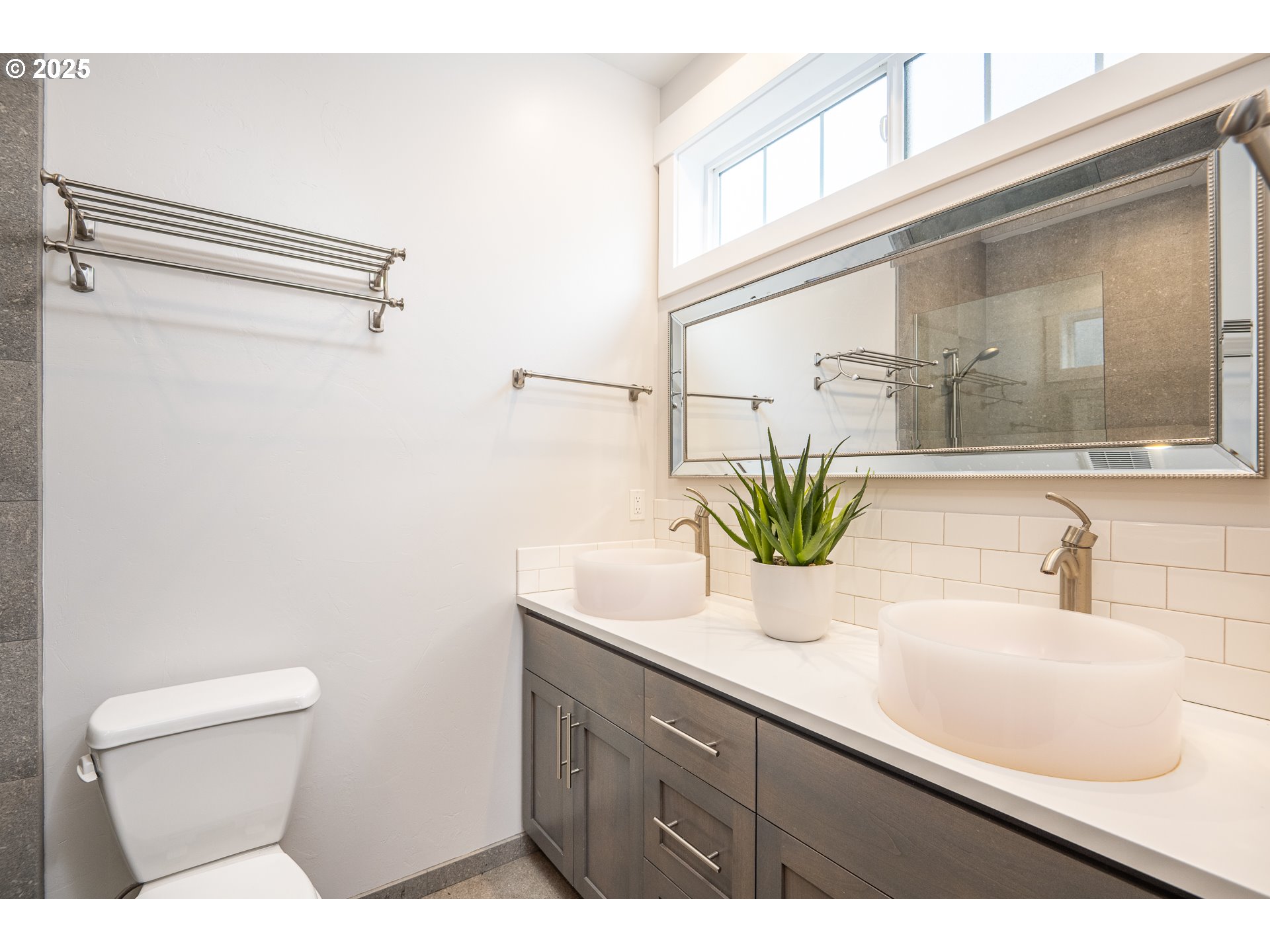 2355 Pioneer Pike Eugene, OR 97401 - Photo 21 of 29 a bathroom with a sink a toilet and mirror