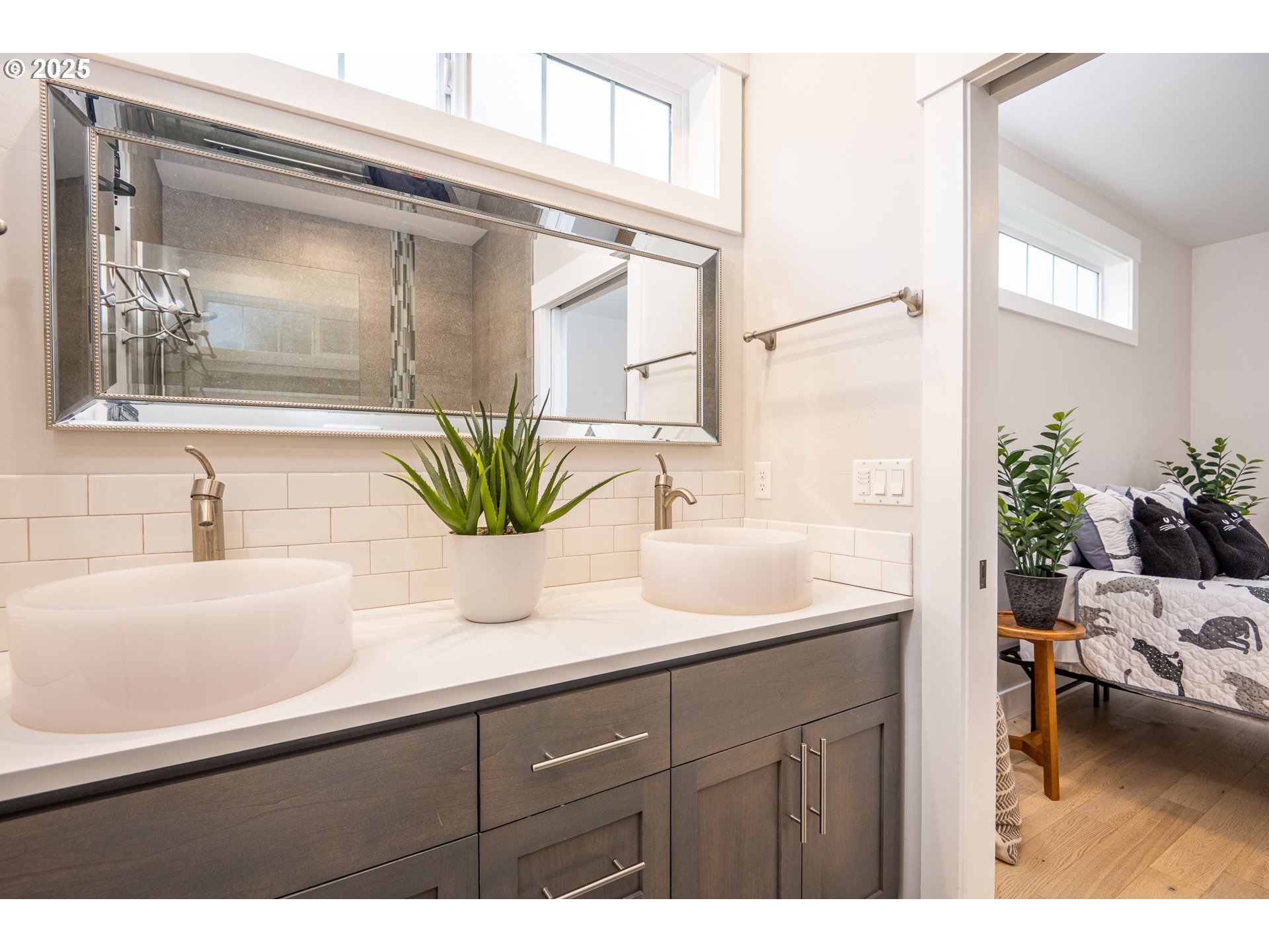 2355 Pioneer Pike Eugene, OR 97401 - Photo 23 of 29 a bathroom with a sink a mirror and a potted plant