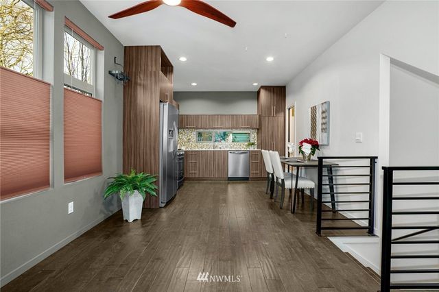 an open kitchen with dining table and chairs