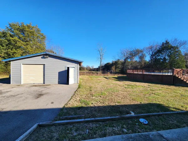 a view of a backyard of the house