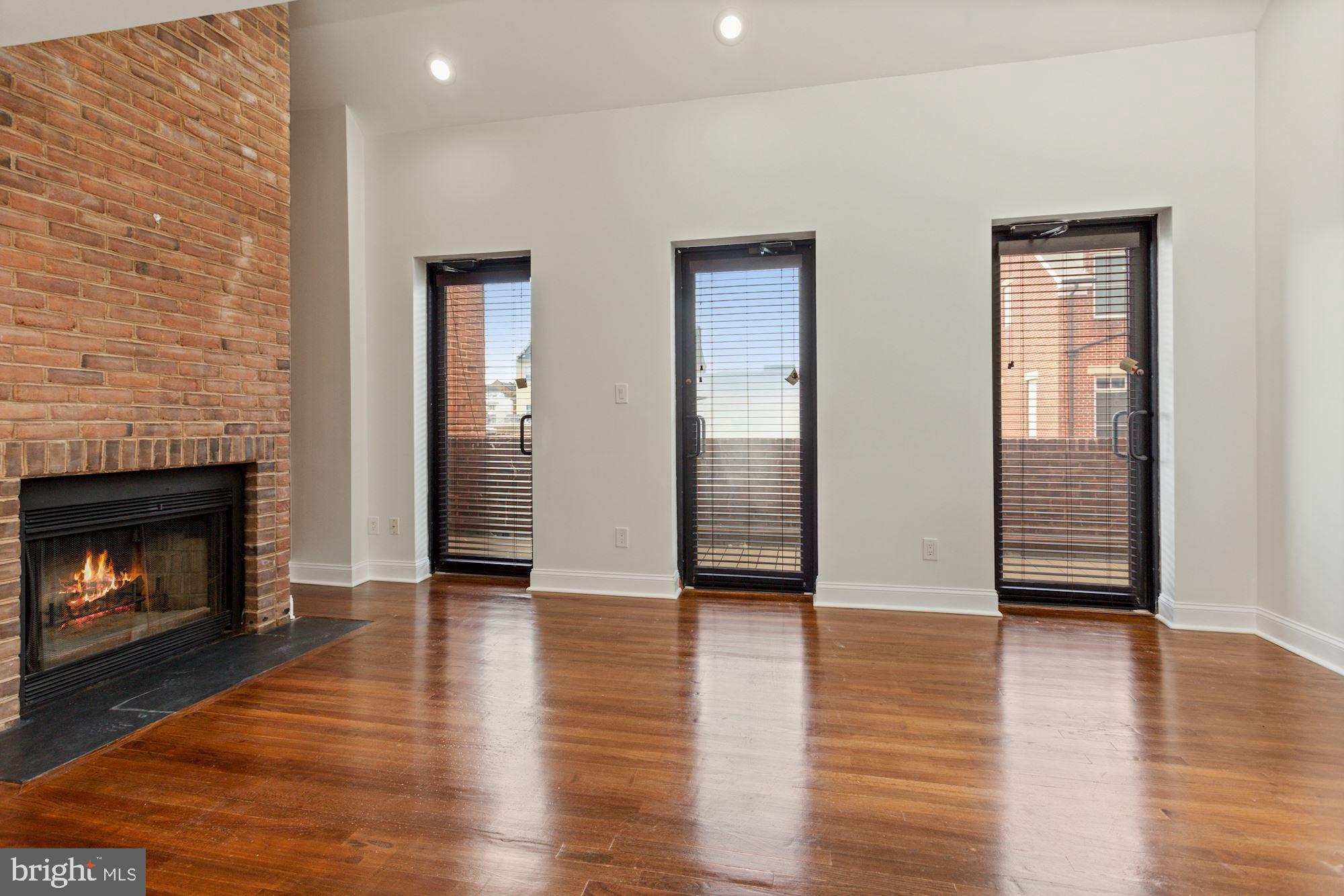 1230 31st Street Northwest, Unit 6 Washington, DC 20007 - Photo 4 of 27 Wall of glass doors leading to a huge balcony