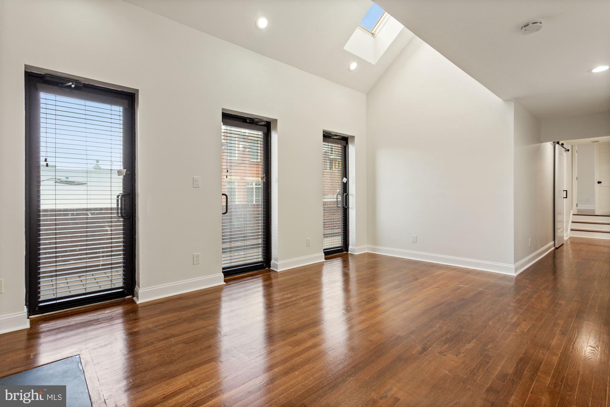 1230 31st Street Northwest, Unit 6 Washington, DC 20007 - Photo 5 of 27 Wall of glass doors leading to a huge balcony