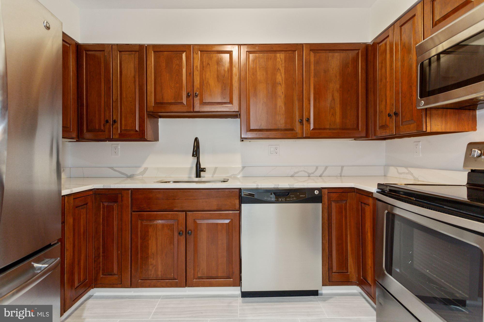 1230 31st Street Northwest, Unit 6 Washington, DC 20007 - Photo 9 of 27 Renovated kitchen with new appliances