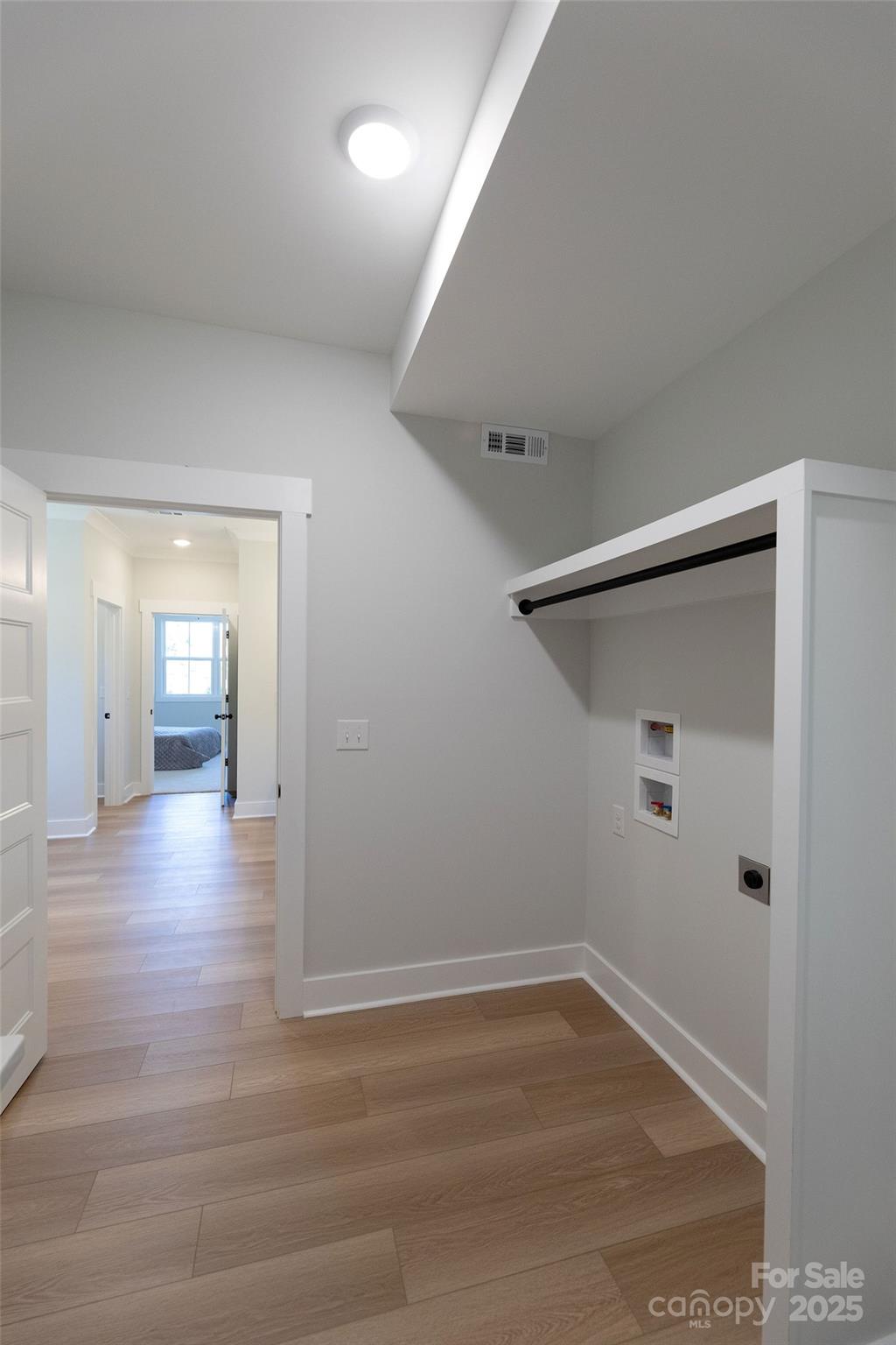 3046 Meadowcrest Drive, Unit 69 Clover, SC 29710 - Photo 12 of 42 a view of a hallway with wooden floor and closet