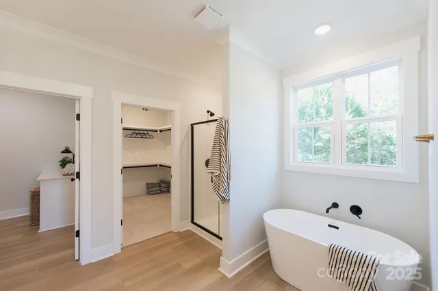 a bathroom with a bathtub and a shower