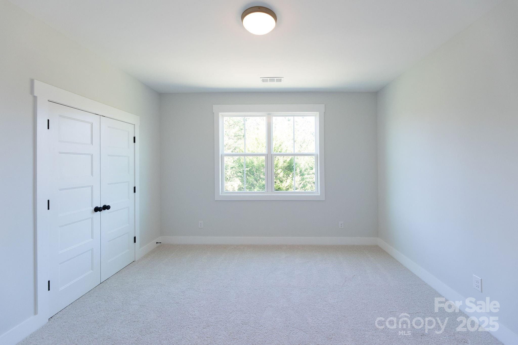 3046 Meadowcrest Drive, Unit 69 Clover, SC 29710 - Photo 19 of 42 an empty room with a window