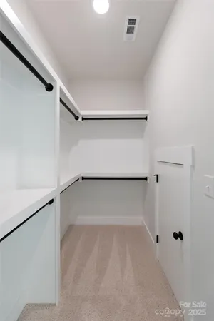 a view of an empty walk in closet