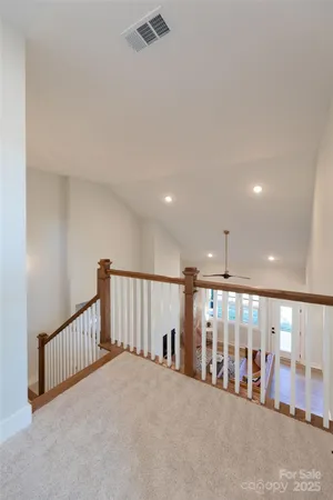 a view of a hallway with a room