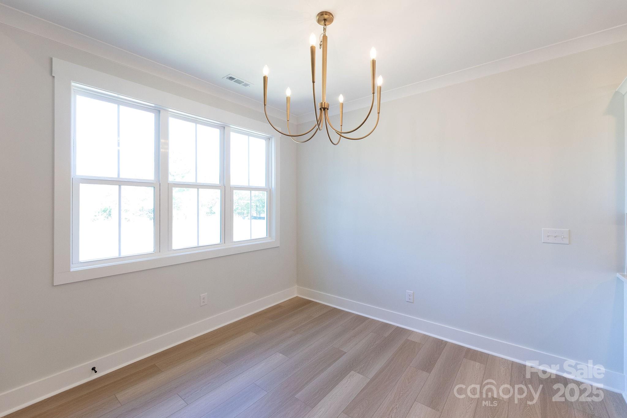 3046 Meadowcrest Drive, Unit 69 Clover, SC 29710 - Photo 29 of 42 a view of a room with wooden floor and windows