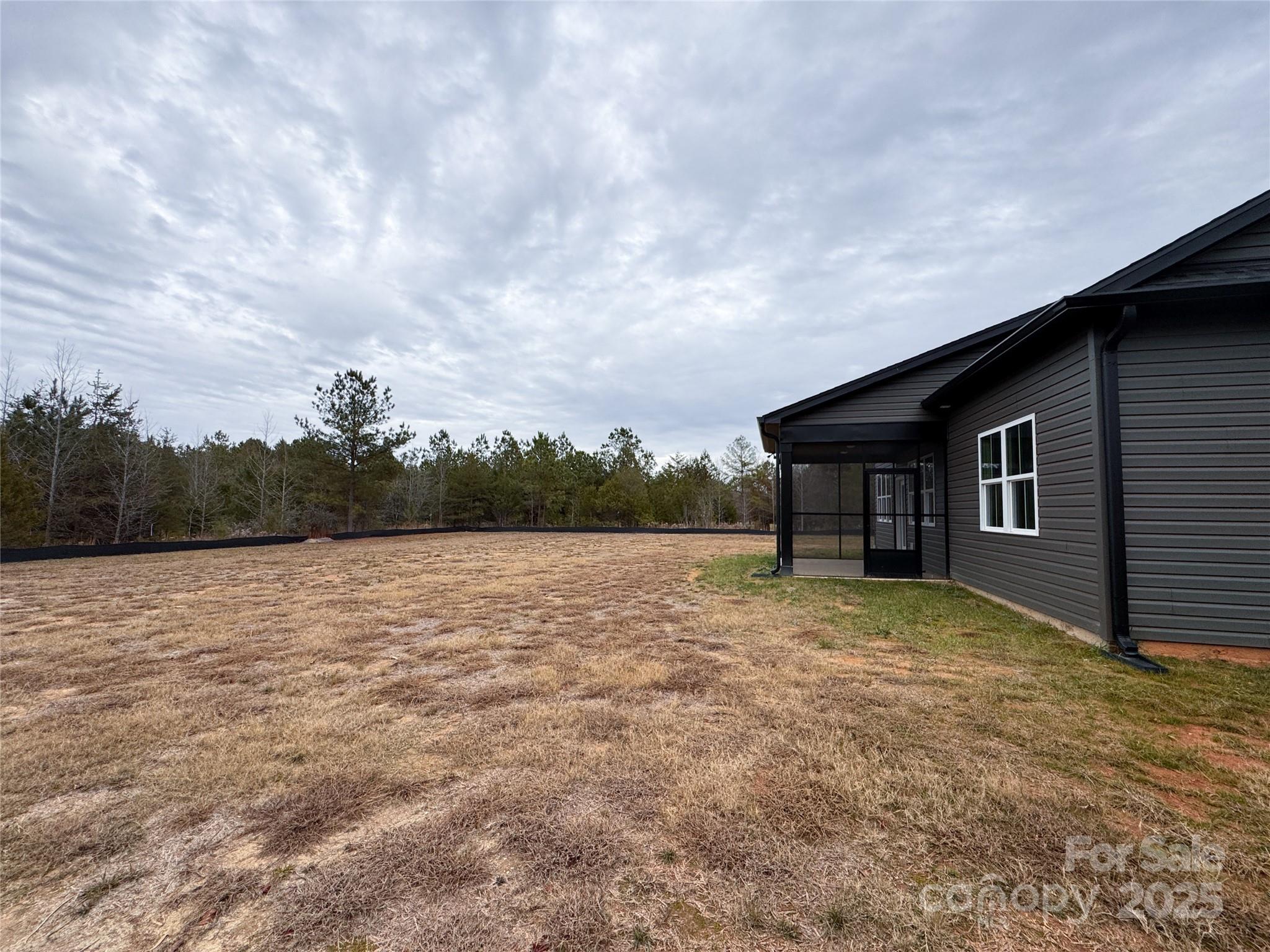 3046 Meadowcrest Drive, Unit 69 Clover, SC 29710 - Photo 4 of 42 a backyard of a house with lots of green space