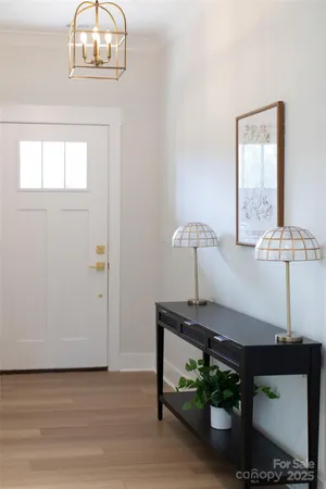 a view of a room with a table and chairs