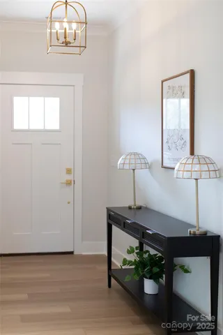 a view of a room with a table and chairs