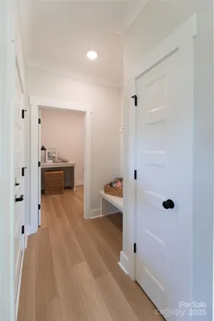 a view of a room with wooden floor and cabinet