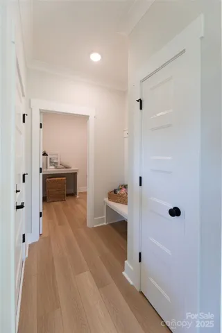 a view of a room with wooden floor and cabinet