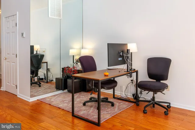 a living room with furniture rug and window