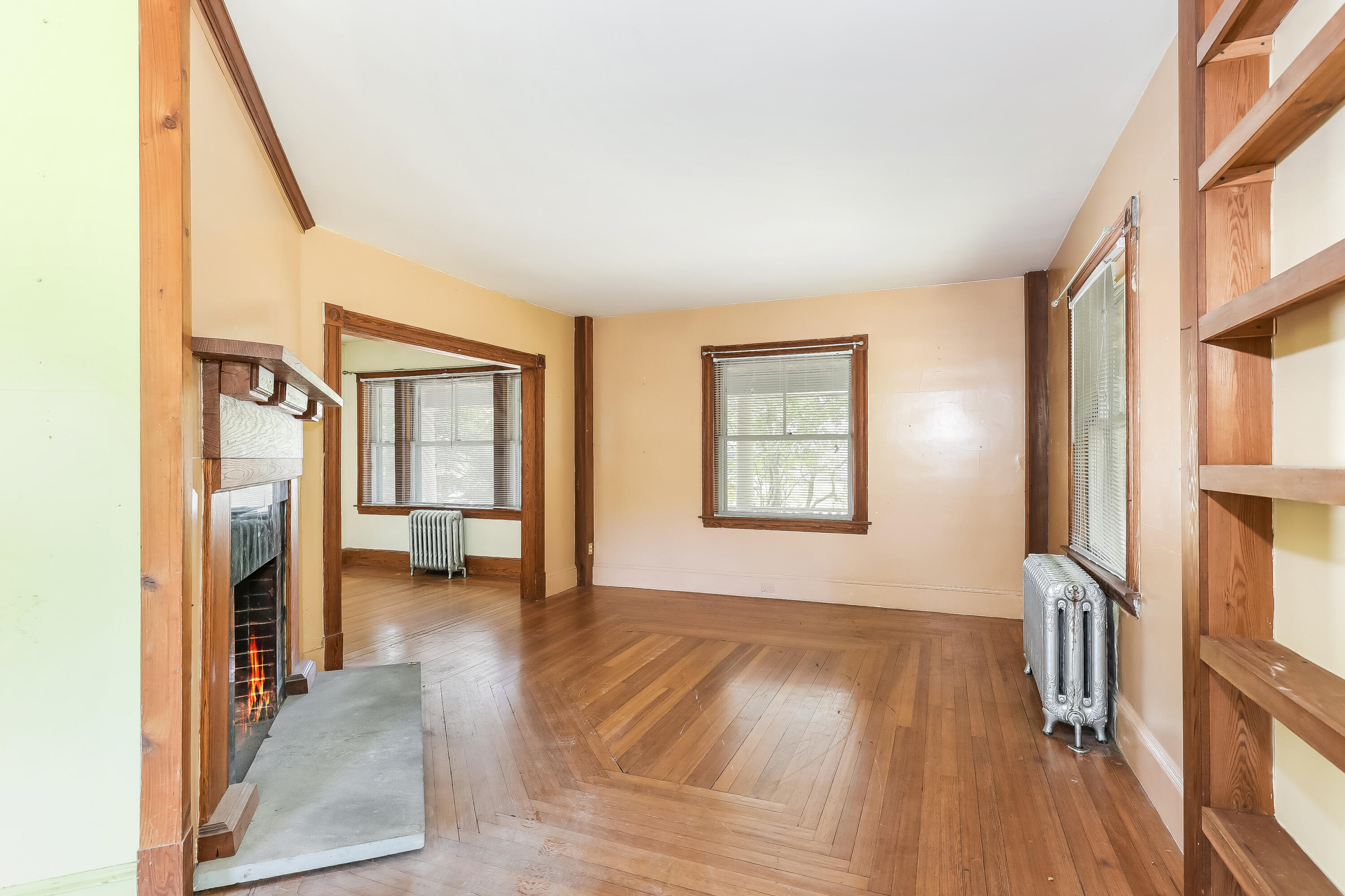 1021 Sandwich Road Sagamore, MA 02561 - Photo 4 of 18 a view of a hallway with wooden floor and a living room