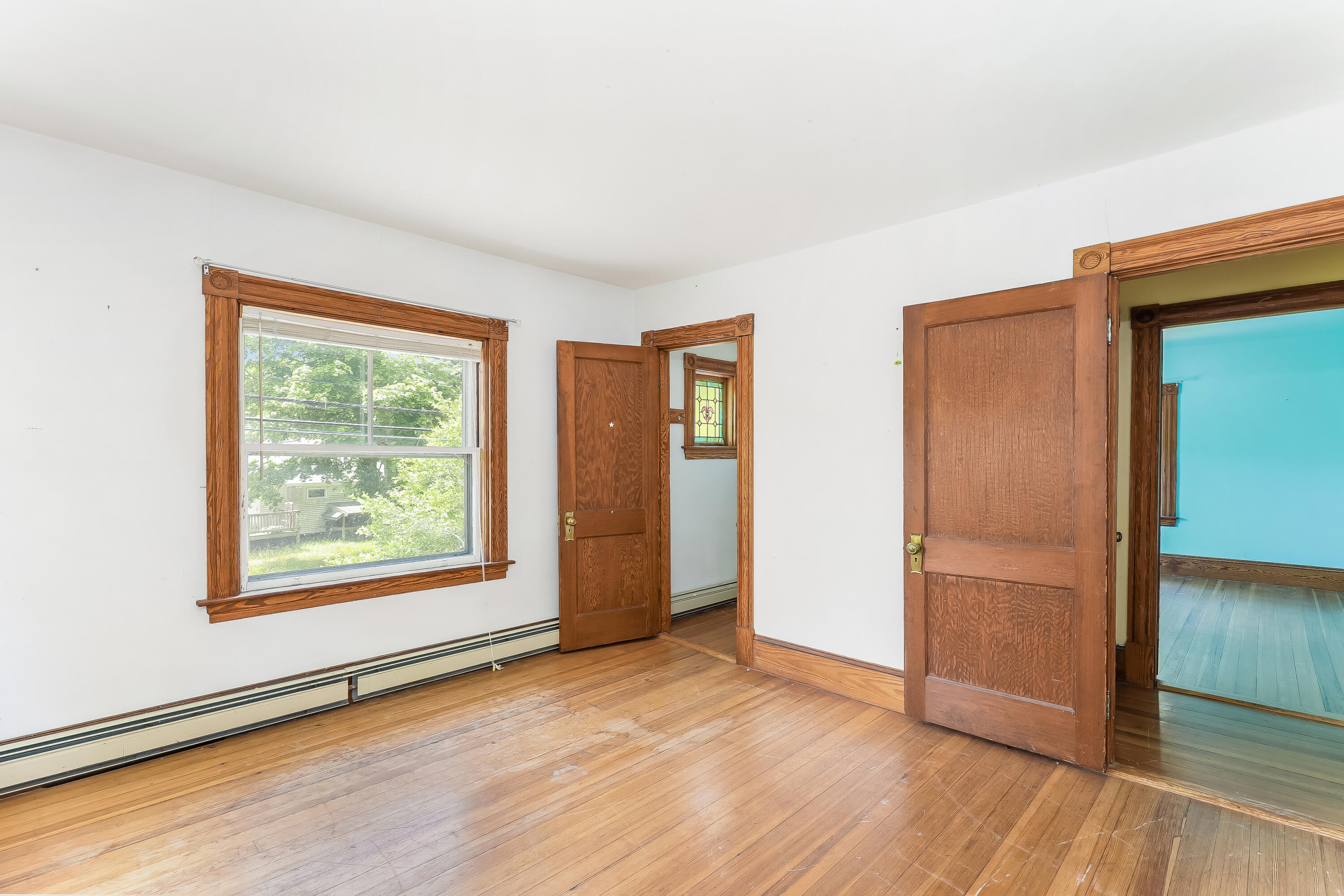 1021 Sandwich Road Sagamore, MA 02561 - Photo 9 of 18 an empty room with wooden floor closet and windows