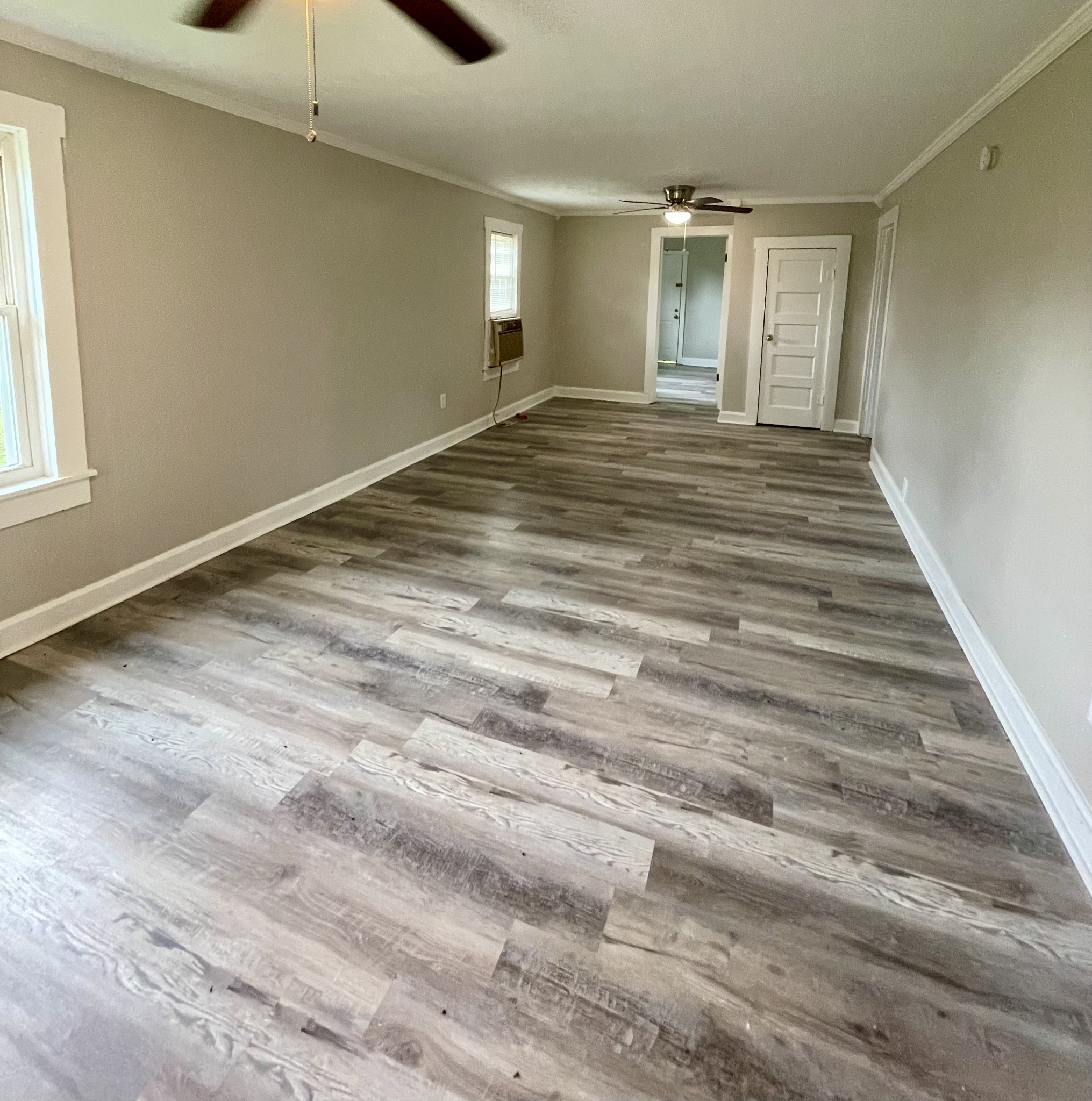 110 Shannon Road Leoma, TN 38468 - Photo 4 of 9 a view of an empty room with wooden floor and a window