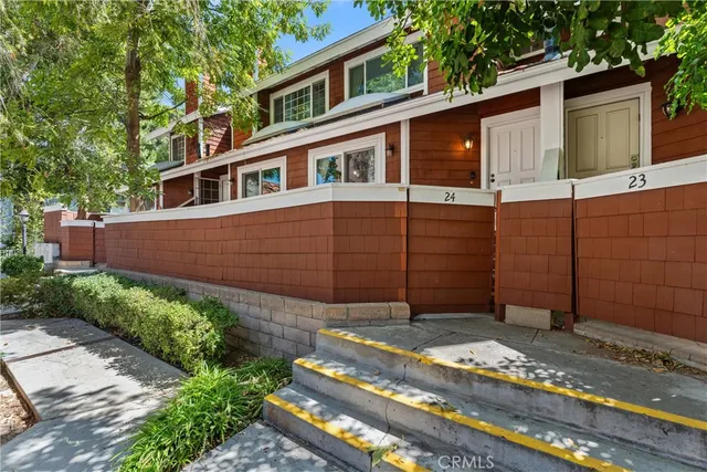 a house view with a garden space