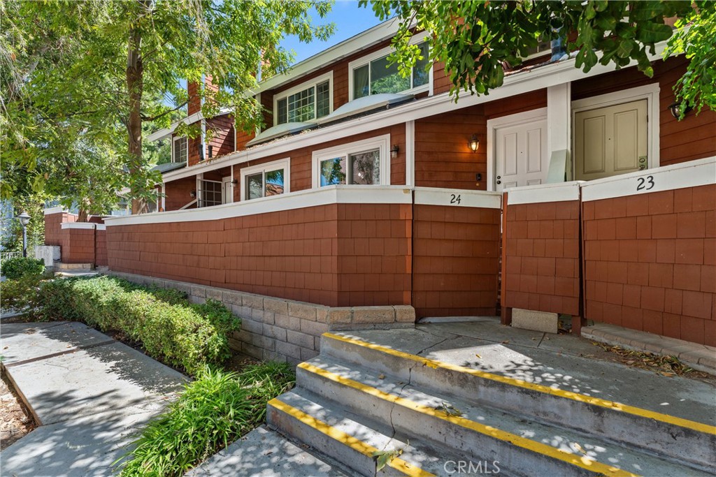 a house view with a garden space