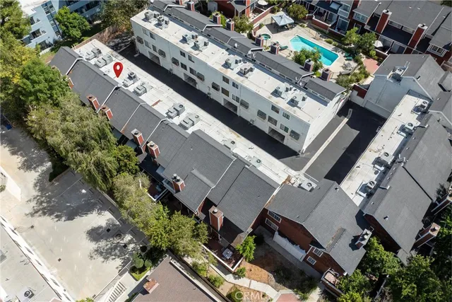 an aerial view of a city with lots of residential buildings