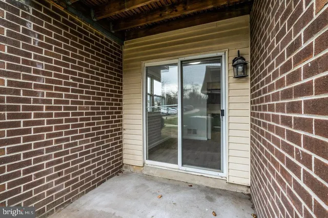 a view of outdoor space with a brick wall