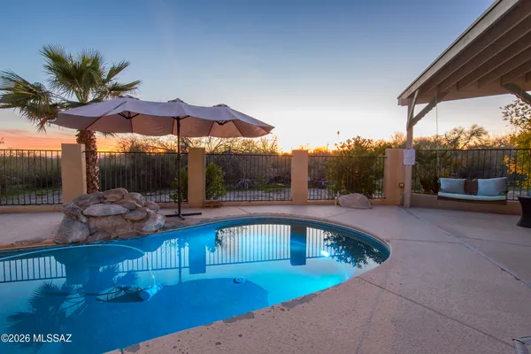 a view of a swimming pool with a patio